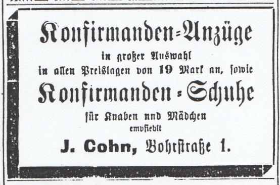 Aufschrift: Konfirmanden-Anzüge - in großer Auswahl - in allen Preislagen von 19 Mark an, sowie  - Konfirmanden-Schuhe für Jungen und Mädchen - J. Cohn, Bohrstraße 1